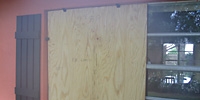 plywood shutter in window